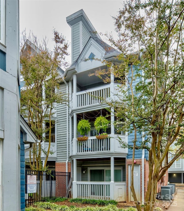 exterior space with ac unit and fence