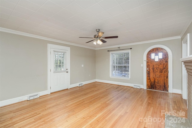 foyer featuring ceiling fan, crown molding, and light hardwood / wood-style flooring