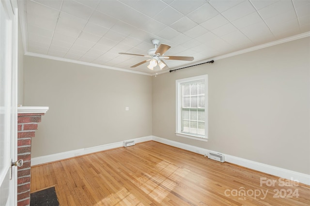 unfurnished room with hardwood / wood-style floors, ceiling fan, and ornamental molding