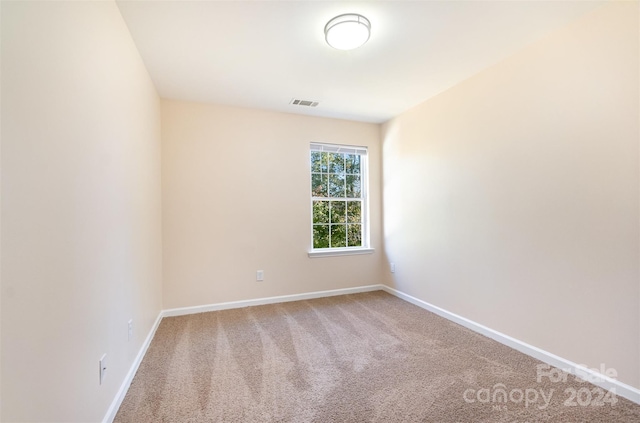 unfurnished room with carpet floors