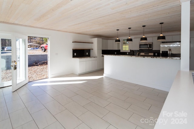 kitchen featuring decorative backsplash, dark stone counters, wood ceiling, stainless steel appliances, and hanging light fixtures