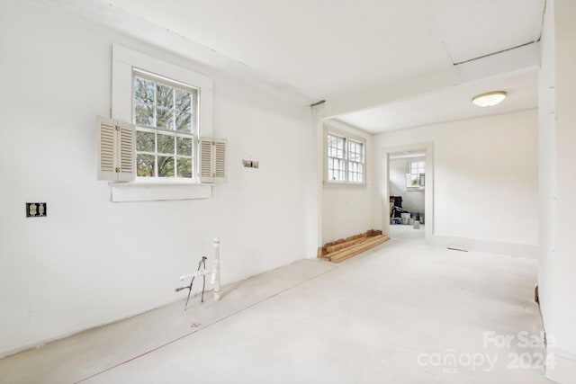 empty room with concrete flooring