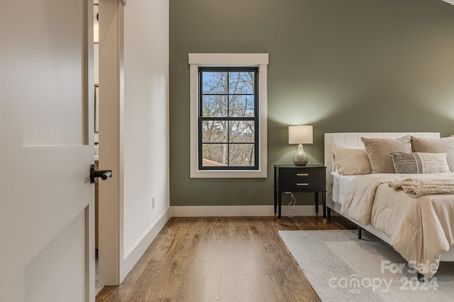 unfurnished bedroom featuring hardwood / wood-style flooring