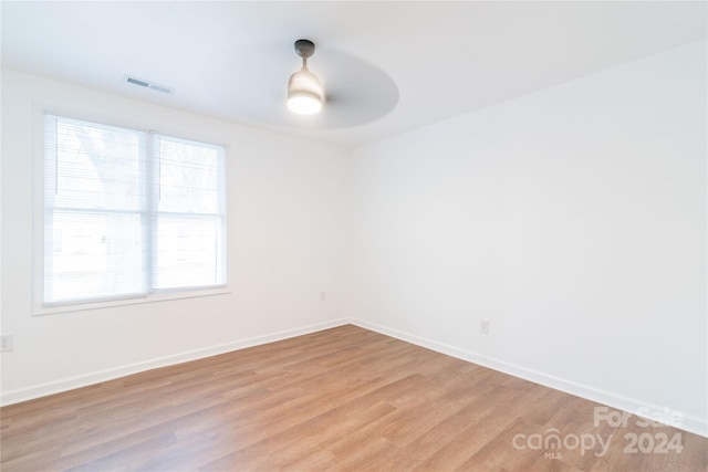 unfurnished room featuring ceiling fan and light hardwood / wood-style floors