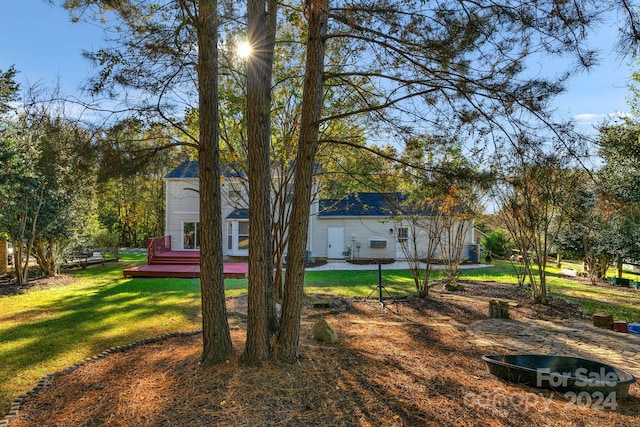 view of yard featuring a wooden deck