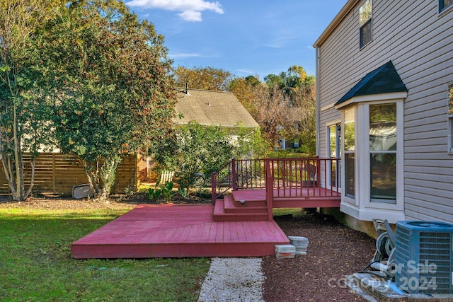 wooden deck featuring central air condition unit