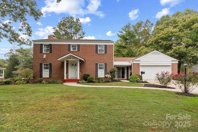 view of front of house with a front lawn and a garage