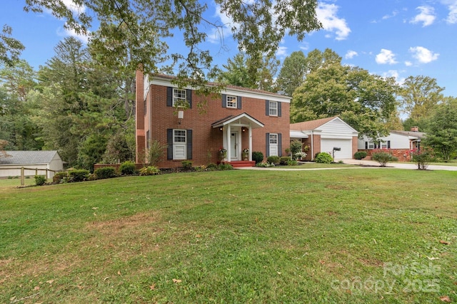 view of front of property with a garage and a front yard