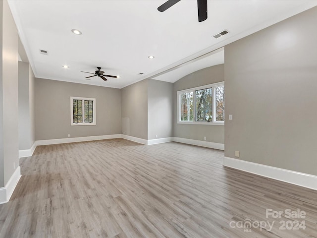 unfurnished living room featuring light wood-type flooring, ceiling fan, and ornamental molding