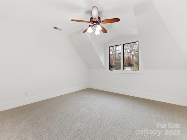 additional living space featuring lofted ceiling, carpet floors, and ceiling fan