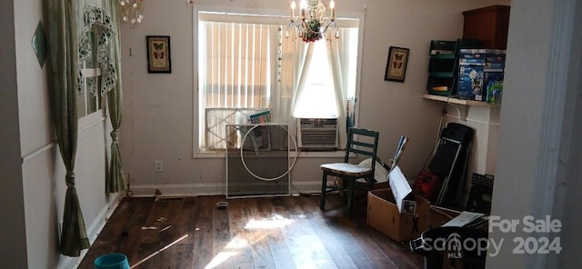 miscellaneous room featuring cooling unit, dark hardwood / wood-style flooring, and an inviting chandelier