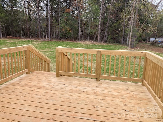 wooden terrace with a yard