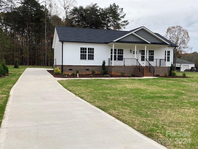 view of front of home featuring a front lawn and covered porch