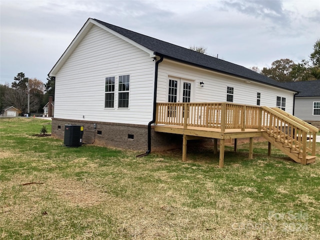 rear view of house with a yard, central AC, and a deck