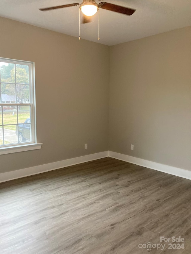 unfurnished room featuring wood-type flooring and ceiling fan