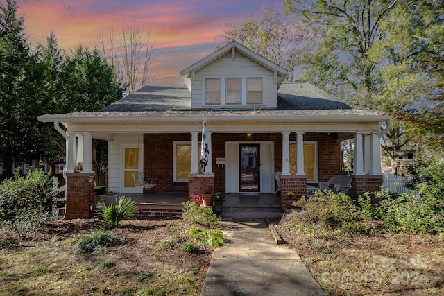 craftsman-style home featuring covered porch