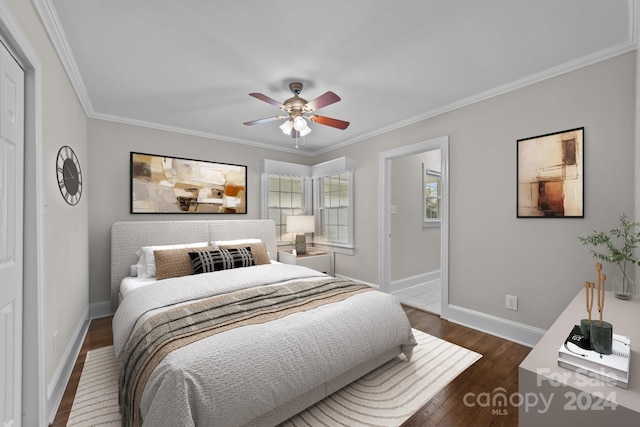 bedroom featuring ceiling fan, dark hardwood / wood-style floors, and ornamental molding