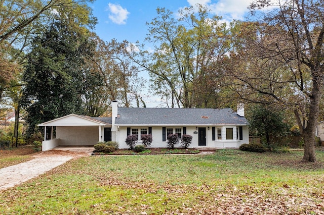 ranch-style house with a front lawn and a carport