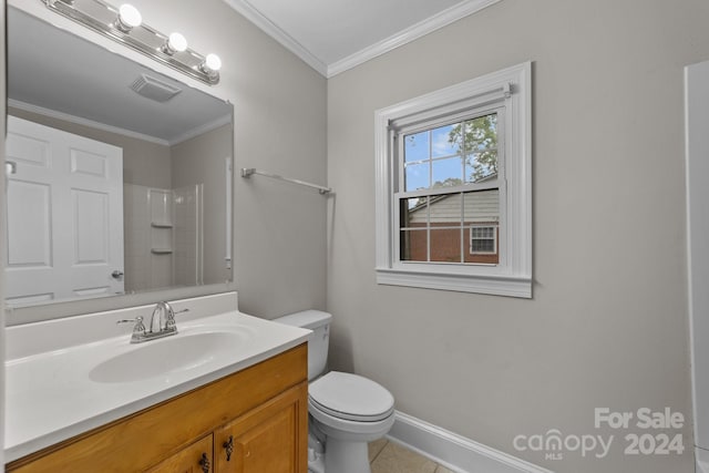 bathroom with tile patterned flooring, vanity, toilet, and ornamental molding