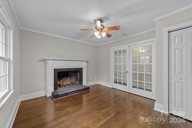 unfurnished living room with dark hardwood / wood-style flooring, ceiling fan, plenty of natural light, and ornamental molding