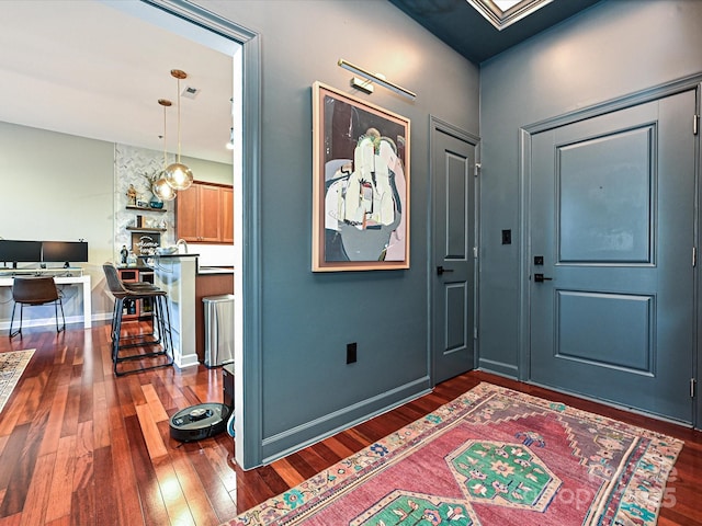 foyer featuring dark wood-type flooring