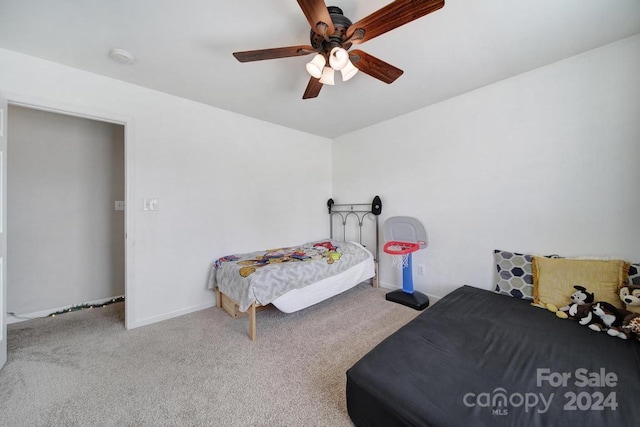 bedroom featuring ceiling fan and light carpet