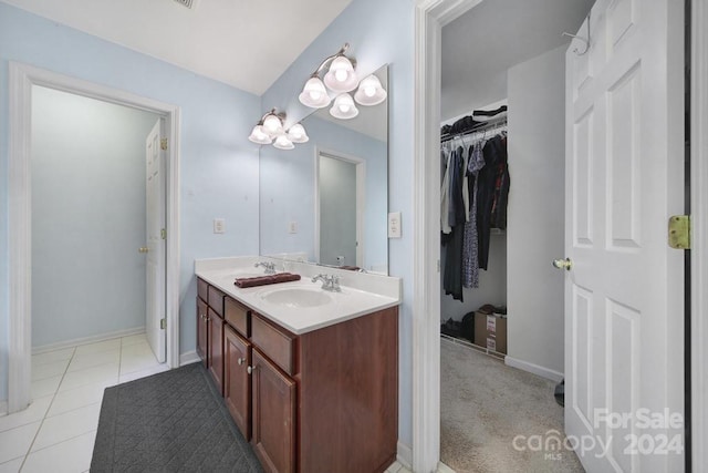 bathroom with tile patterned floors and vanity