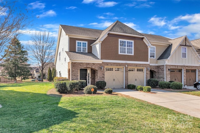 view of front of home with an attached garage, a front lawn, concrete driveway, and brick siding