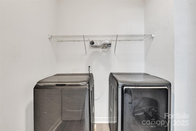 washroom featuring laundry area and washer and dryer