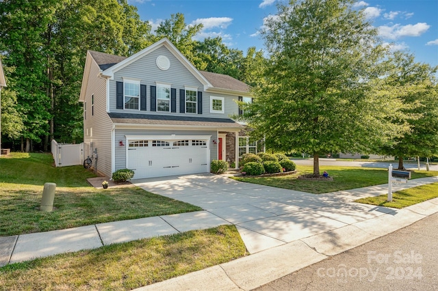 view of front facade with a garage and a front lawn