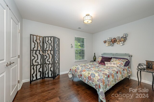 bedroom featuring dark wood-type flooring