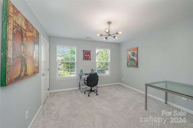 carpeted office space with an inviting chandelier