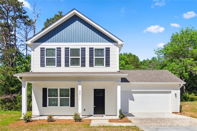 view of front of house featuring board and batten siding, covered porch, a garage, and driveway