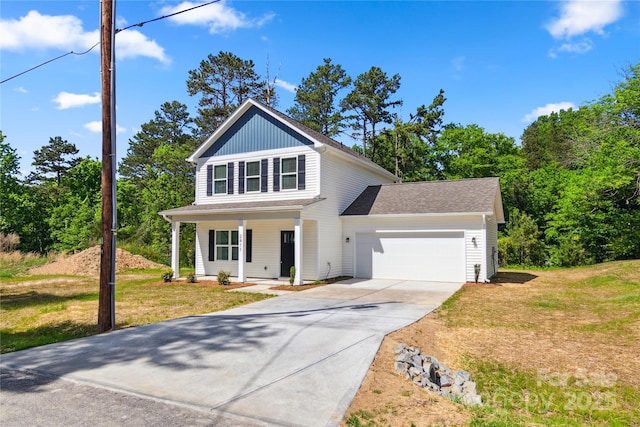 view of front of home with a garage, a porch, concrete driveway, and a front lawn