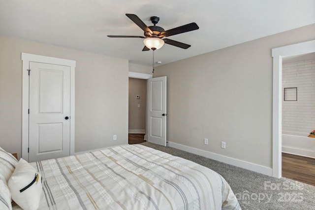 bedroom with carpet flooring, ceiling fan, ensuite bathroom, and baseboards