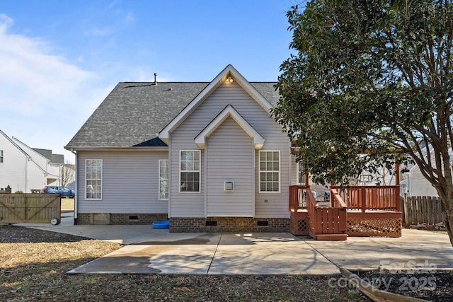 back of house featuring a patio area and a wooden deck