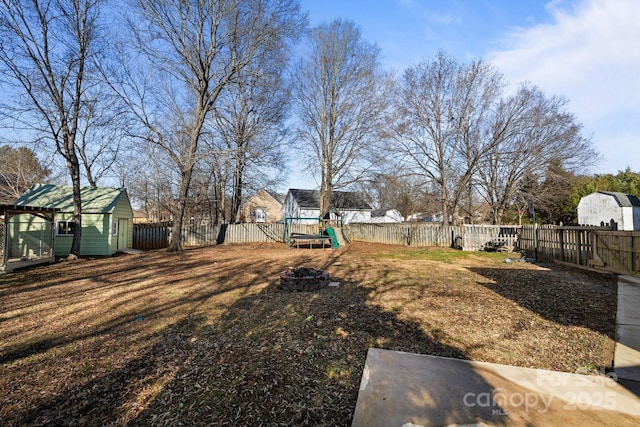 view of yard with a playground and an outdoor structure