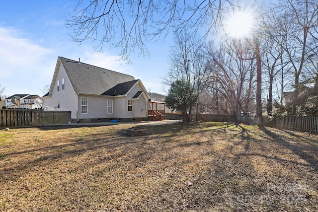 exterior space featuring a wooden deck and a yard