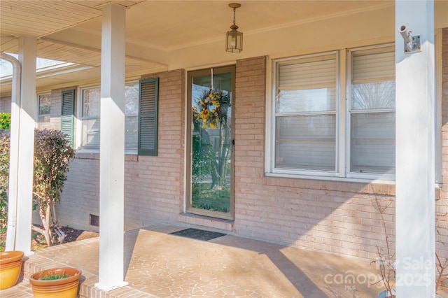 entrance to property with brick siding