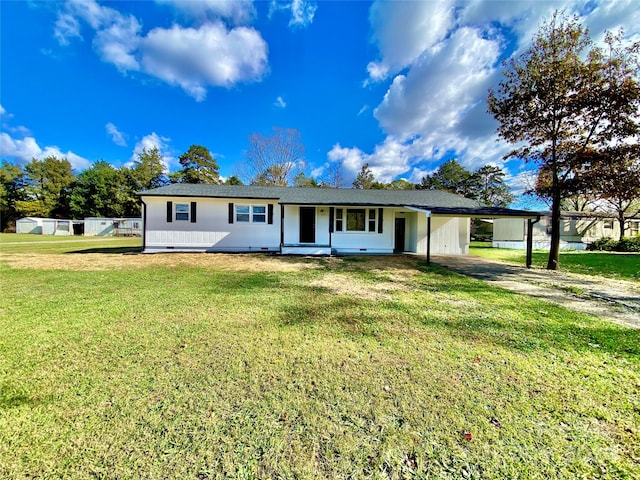 view of front of house with a front yard and a carport