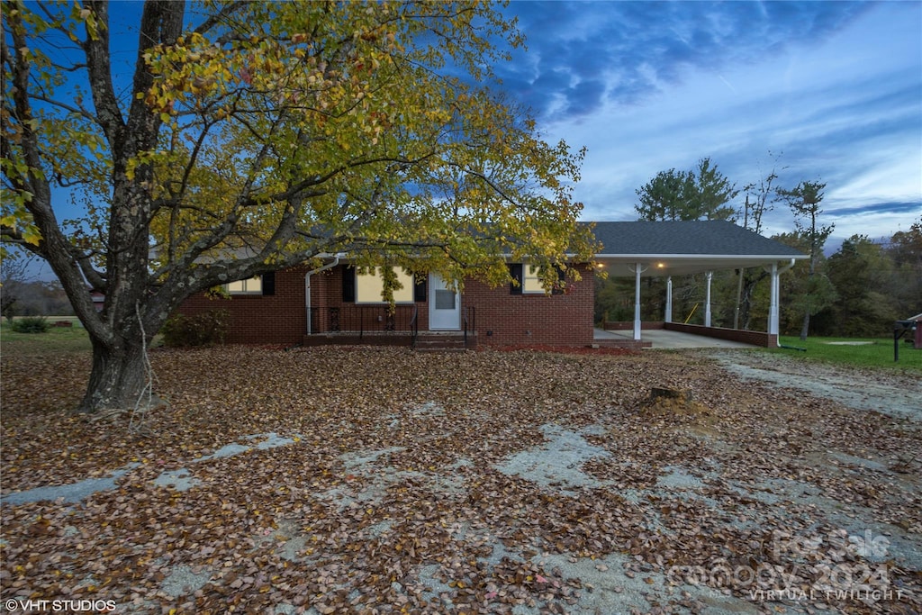 view of front facade with a carport