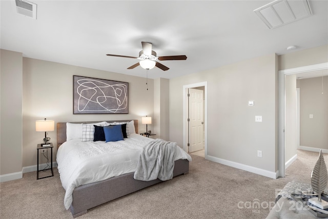 bedroom with ceiling fan and light colored carpet