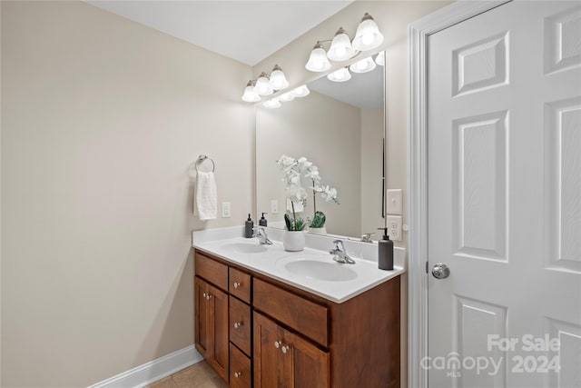 bathroom featuring tile patterned flooring and vanity