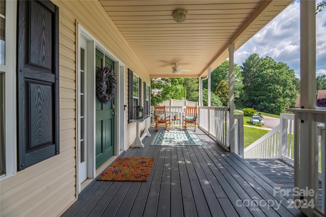 wooden deck featuring ceiling fan and a porch