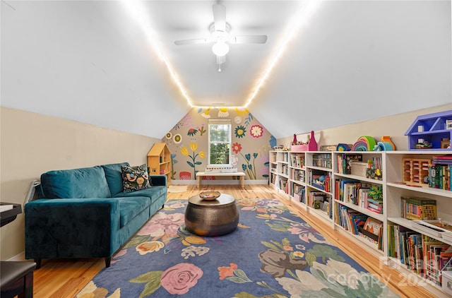 game room with ceiling fan, lofted ceiling, and hardwood / wood-style flooring