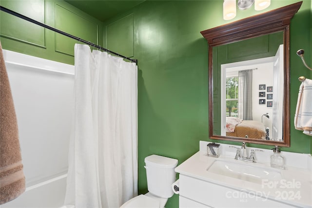 full bathroom featuring vanity, toilet, and shower / bath combo with shower curtain