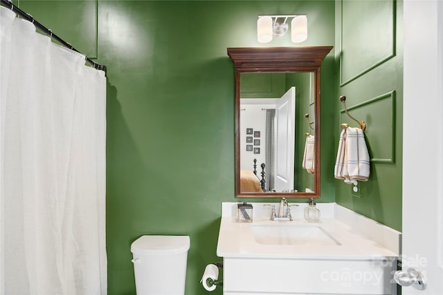 bathroom with vanity and toilet