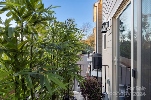 view of side of home with a balcony