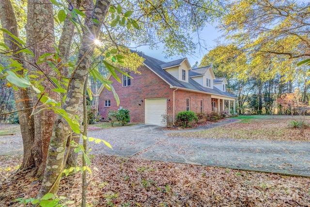 view of side of property with a garage