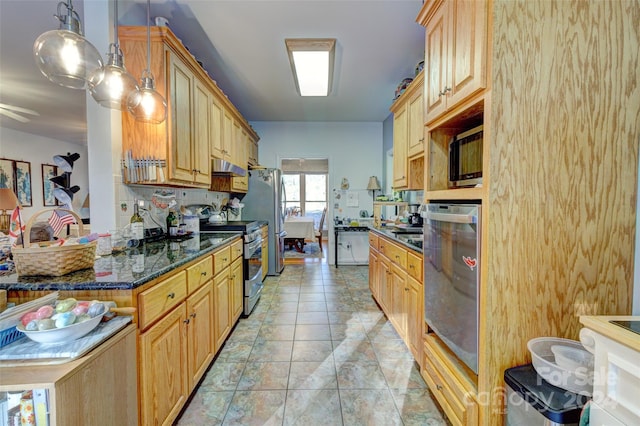 kitchen with stainless steel appliances, dark stone countertops, pendant lighting, light brown cabinetry, and light tile patterned floors